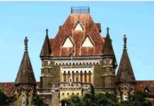 ਭੀੜ ਕਾਰਨ ਟਰੇਨ ਦੇ ਦਰਵਾਜ਼ੇ `ਤੇ ਖੜ੍ਹੇ ਹੋ ਕੇ ਸਫਰ ਕਰਨਾ ਲਾਪ੍ਰਵਾਹੀ ਨਹੀਂ Bombay High Court